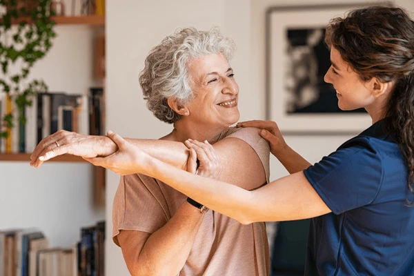 happy-senior-woman-doing-exercise-home-600nw-1900084774